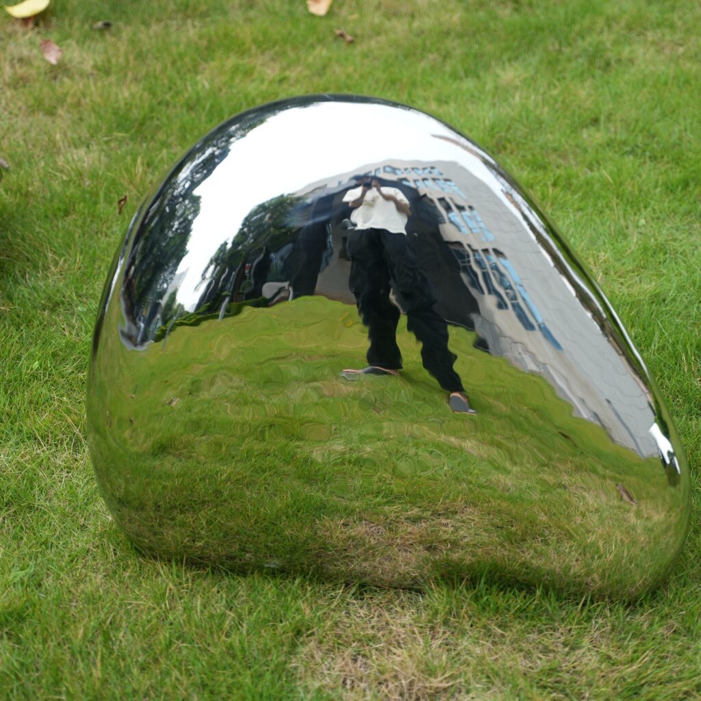 Stainless steel high gloss stone sculpture. From sculptural concept to detailed production, we create unique artworks tailored for each client.